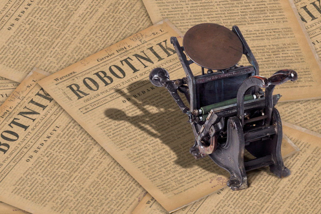 maszyna drukarska bostonka na tle pierwszego numeru "Robotnika"
